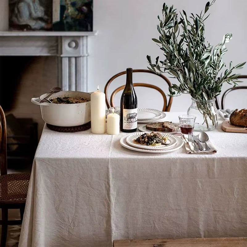 A considered tablescape with candles, glassware, and florals